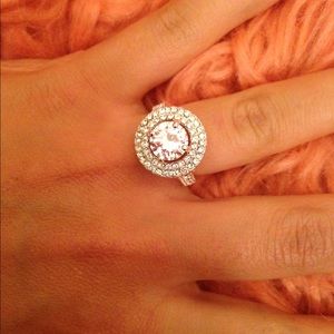 Halo engagement ring with diamond accent